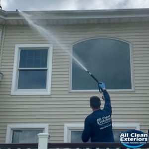 employee soft wash power washing vinyl siding in Fair Haven, NJ