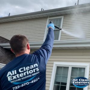 employee soft wash power washing vinyl siding in Fair Haven, NJ