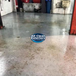 cleaning dirt and oil off a garage floor in Long Branch, NJ